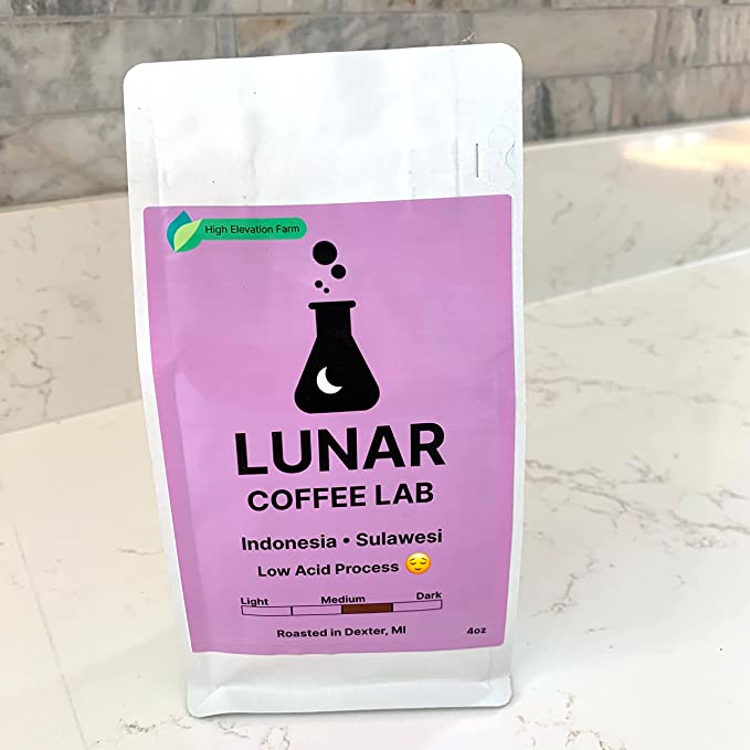 Lunar Coffee Lab Indonesia Sulawesi low-acid coffee in a white pouch with an orchid label and the moon-and-flask mark.